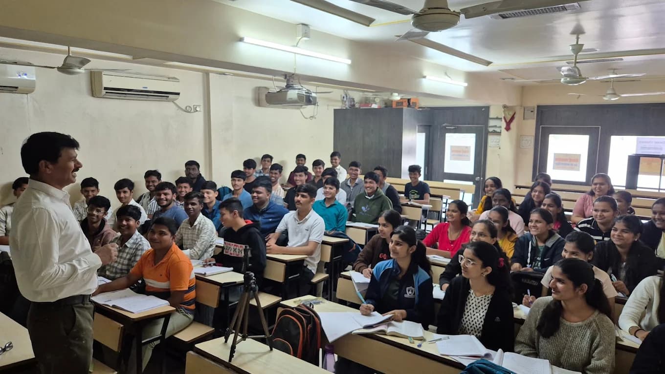 Teacher actively teaching students at Desai Classes